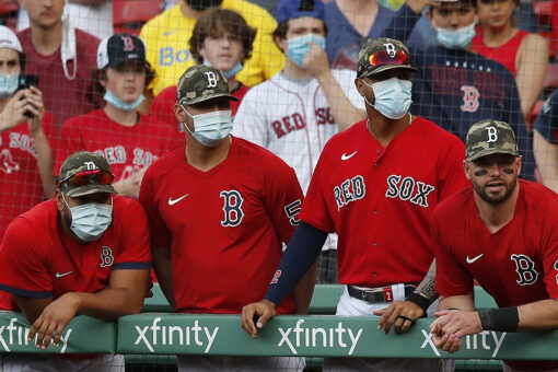 Red Sox fan comes up with flying bat while talking on phone during game