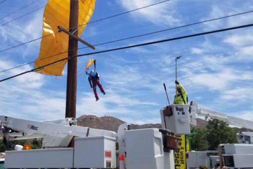 Parachuter gets caught in power lines, left dangling 30-feet in the air for over an hour