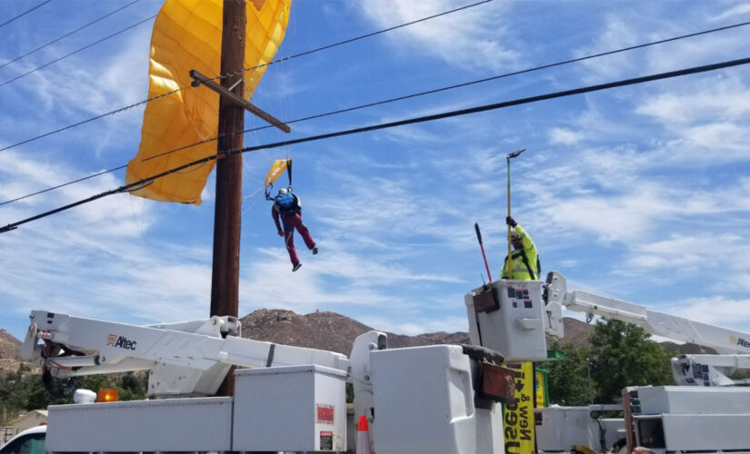 Parachuter gets caught in power lines, left dangling 30-feet in the air for over an hour