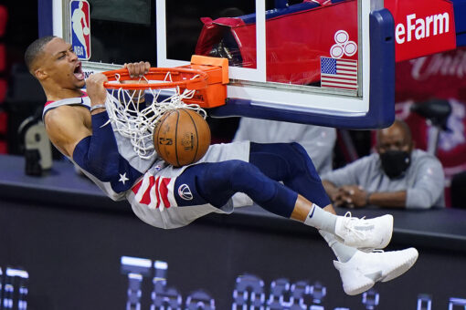 Wizards’ Russell Westbrook has popcorn dumped on him as he walks to locker room