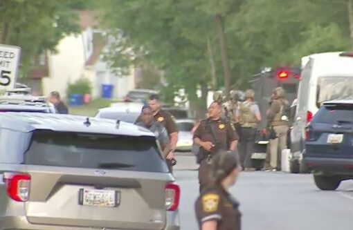 Maryland officers shot while serving arrest warrant, suspect barricaded in home