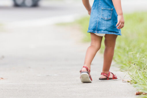 Internet baffled by photo of girl seemingly stuck in sidewalk
