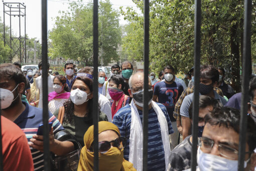 India sees coronavirus surge slowing but experts warn numbers are misleading