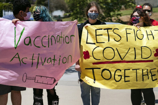 Schools try pep-rally tactics to get students vaccinated