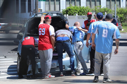 NYPD officers pause softball game to help woman who got in a car crash