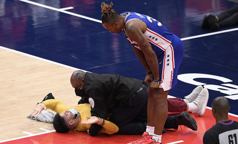 Fans Gone Wild: Spectator tries to get on floor at NBA game