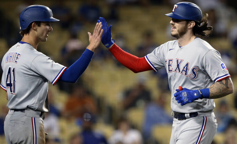 Rangers snap 16-game road losing streak, rout Dodgers 12-1