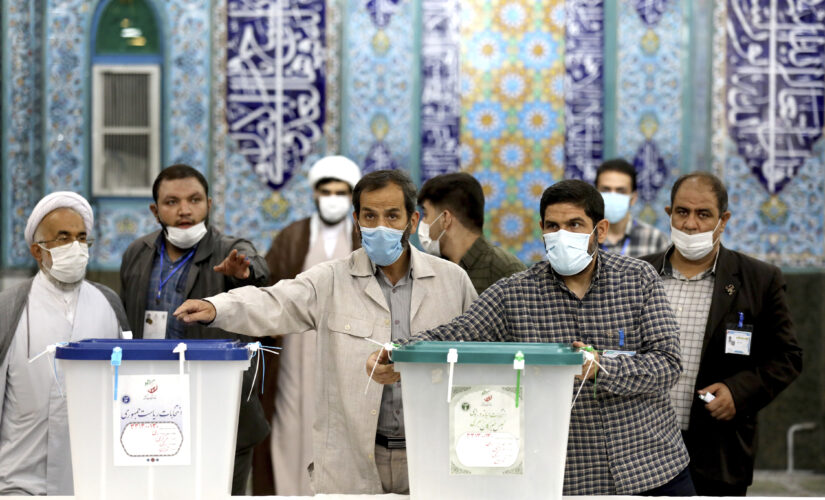 Iran votes in presidential poll tipped in hard-liner’s favor