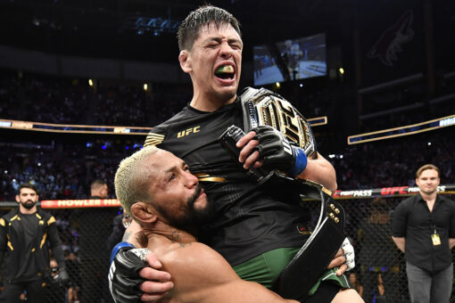 UFC’s Brandon Moreno celebrates with opponent Deiveson Figueiredo after flyweight title victory