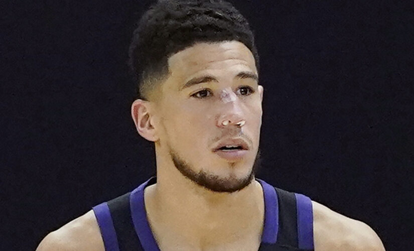 Suns’ Devin Booker bloodied after head bump, returns with stitches