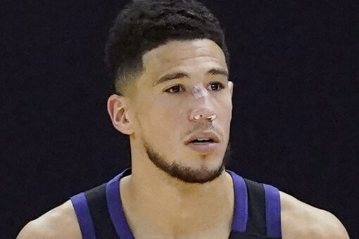 Suns’ Devin Booker bloodied after head bump, returns with stitches