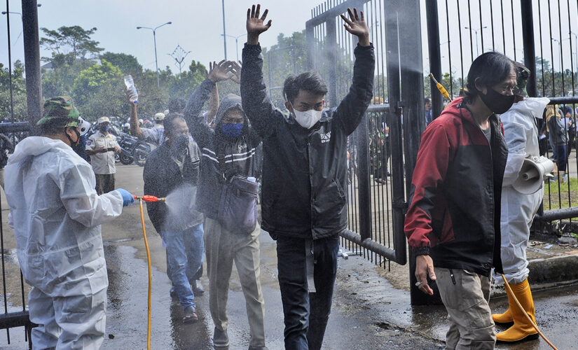 Coronavirus variants behind fresh surge in Indonesia, WHO warns