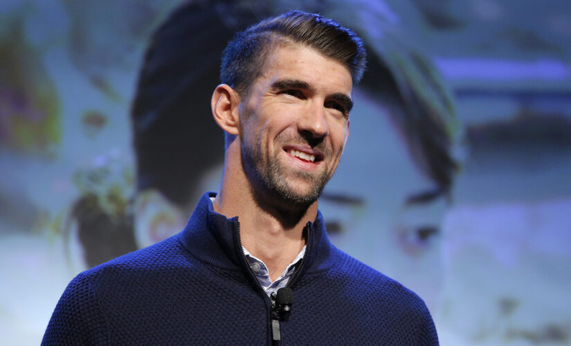 Emotions stir Michael Phelps in his return to US trials