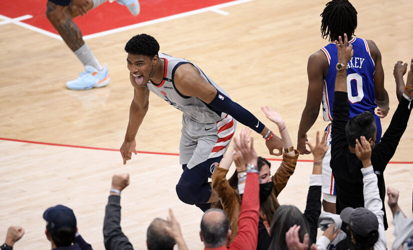 Embiid leaves with sore knee, 76ers lose to Wizards 122-114