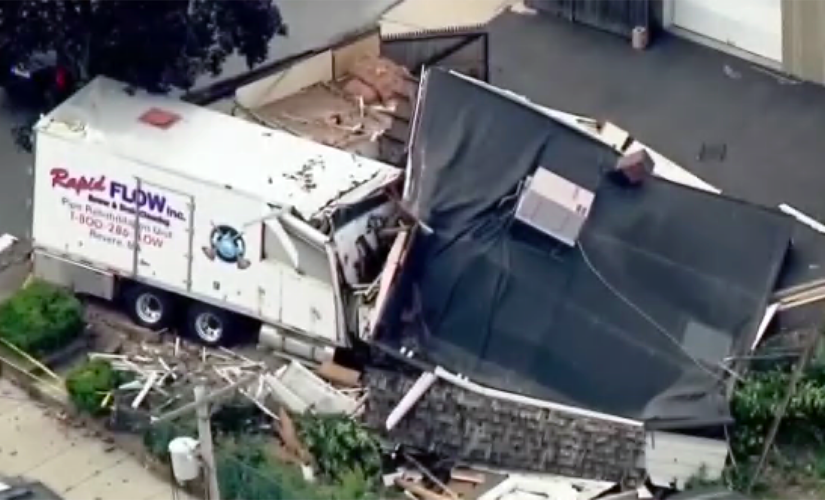 Boston-area man plows stolen truck into house, guns down 2 people before being shot dead by police