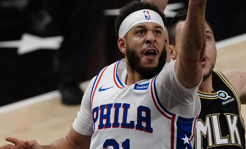 Curry, Harris help 76ers stay alive, hold off Hawks 104-99