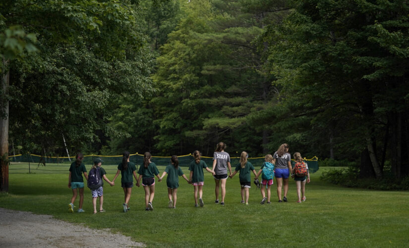 Nearly 100 COVID-19 cases linked to Illinois summer camp, officials say