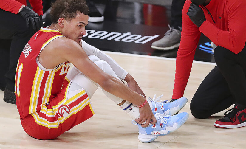 Hawks’ Trae Young injures ankle after stepping on ref’s foot in ‘freaky accident’