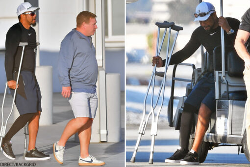 Tiger Woods seen on crutches as he arrives in Los Angeles, presumably for first time since horrific crash