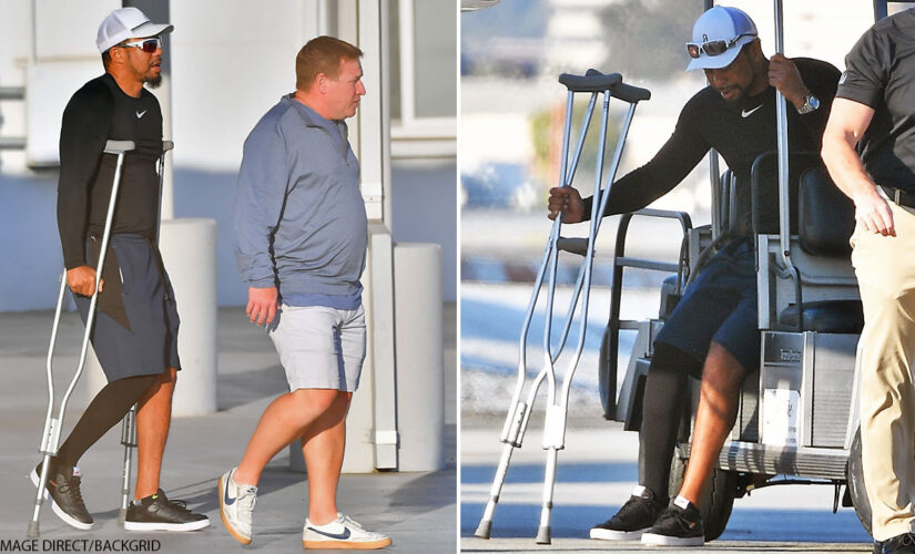 Tiger Woods seen on crutches as he arrives in Los Angeles, presumably for first time since horrific crash