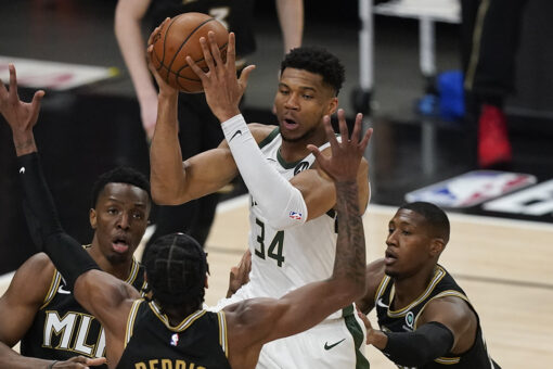 Bucks’ Giannis Antetokounmpo appears to suffer knee injury, leaves raucous crowd silent