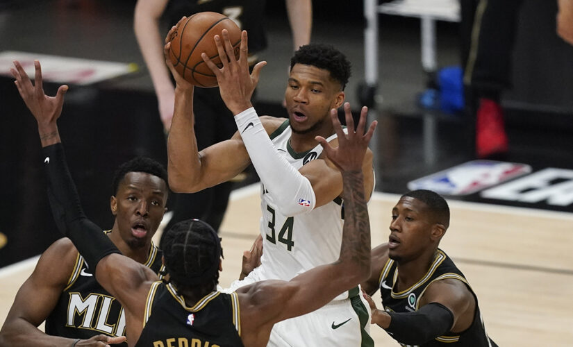 Bucks’ Giannis Antetokounmpo appears to suffer knee injury, leaves raucous crowd silent