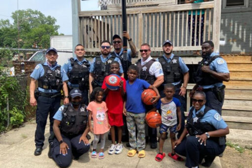Chicago police officers surprise children with new basketball hoop after seeing them play with milk crate