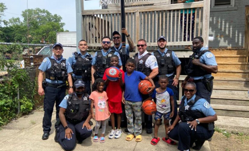 Chicago police officers surprise children with new basketball hoop after seeing them play with milk crate