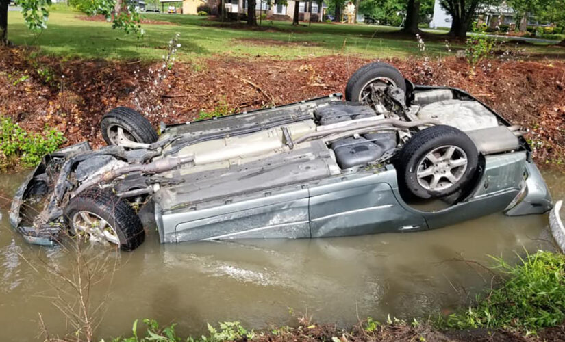 North Carolina police officers hailed as heroes after rescuing woman from overturned, submerged vehicle