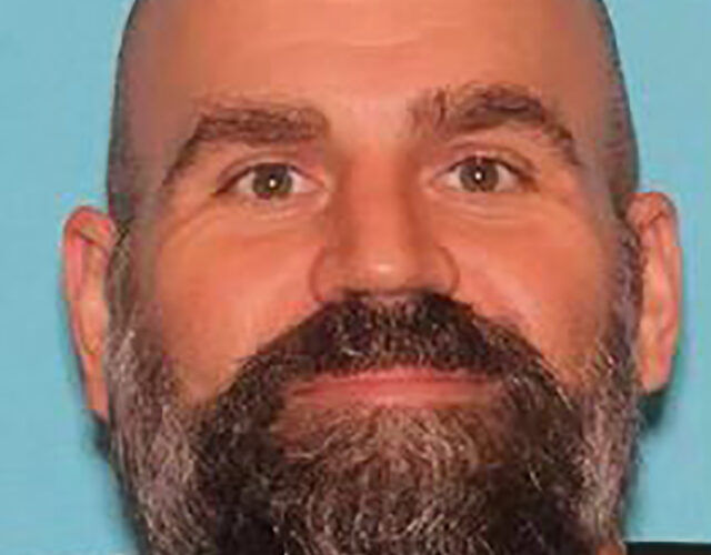 Texas police searching for motorcyclist accused of shooting officer