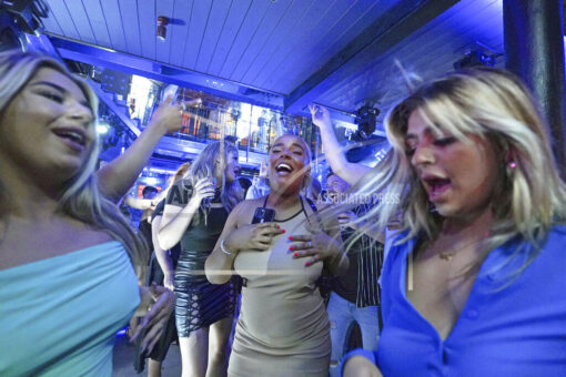 Virus surge fears, UK leader’s quarantine, mar ‘Freedom Day’