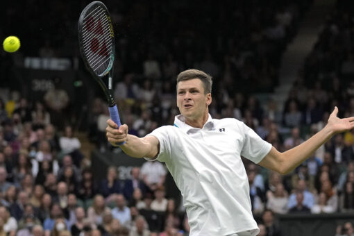 Hurkacz faces idol Federer in 1st Grand Slam quarterfinal