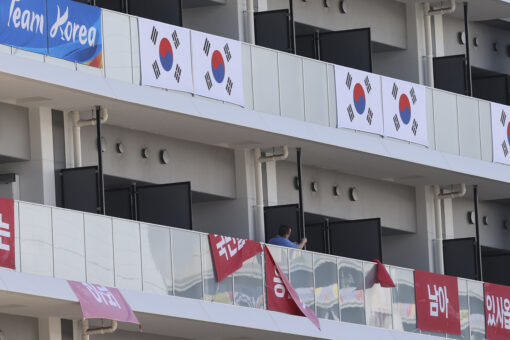 South Korea removes banners at Olympic village after IOC ruling