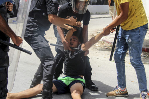 Tunisian president fires premier after violent protests