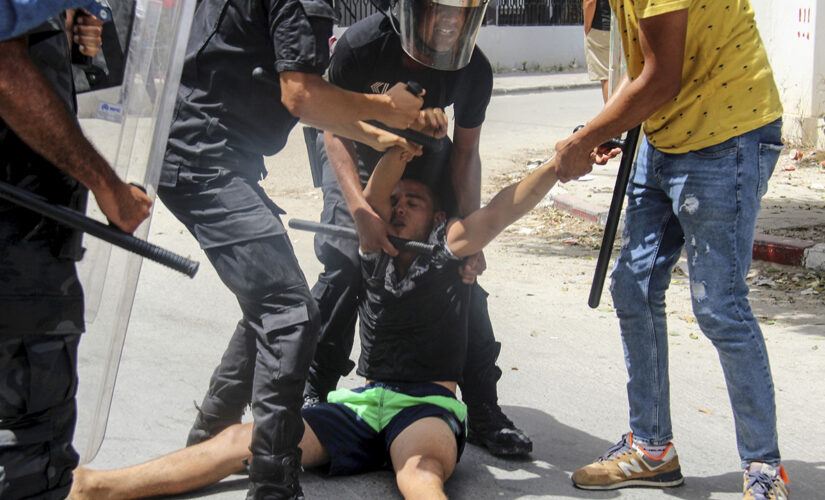 Tunisian president fires premier after violent protests