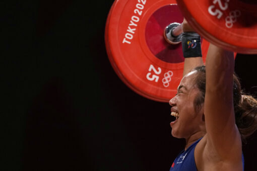 Hidilyn Diaz, Philippines’ first Olympic gold medalist, salutes flag during country’s national anthem