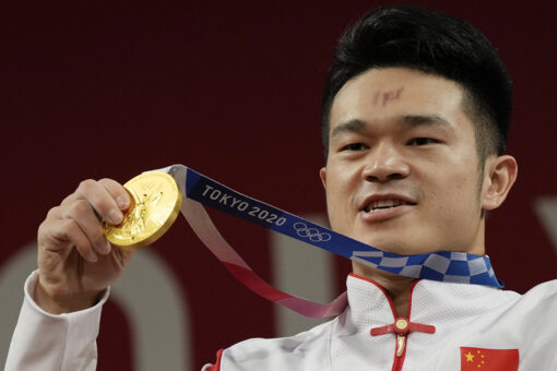 China’s Shi breaks own record to win weightlifting gold