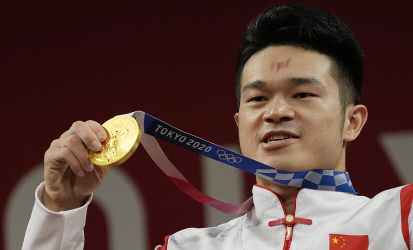 China’s Shi breaks own record to win weightlifting gold