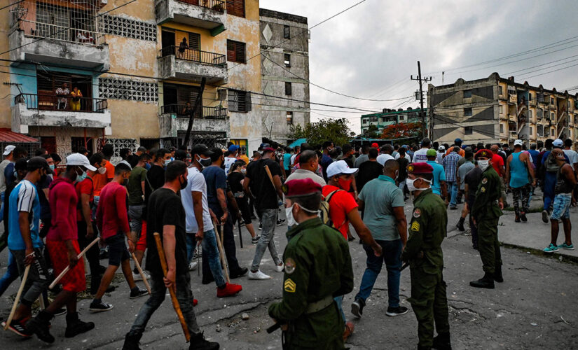 Cuban regime supporters seen brandishing large clubs as protest crackdown continues