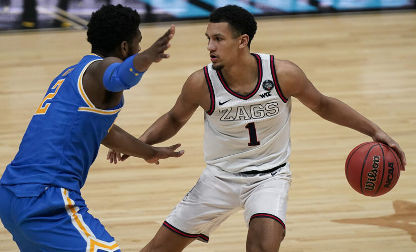 Choosing basketball over football was tough for Jalen Suggs