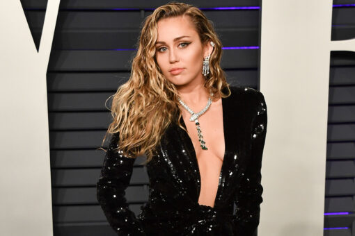 Miley Cyrus poses on dad Billy Ray’s truck in NSFW shirt, heels: Don’t know which he’ll ‘be more pissed about’