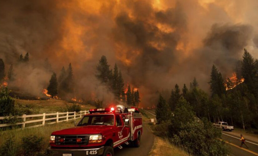 California fire prompts evacuations; Oregon blaze balloons