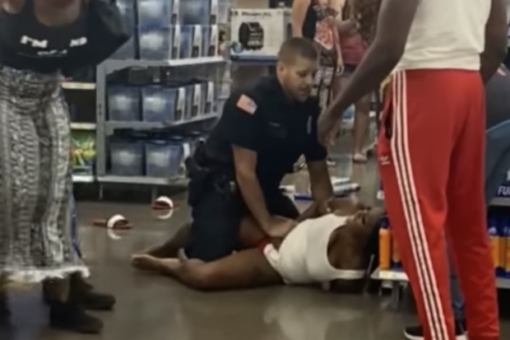 New York police officer placed on paid leave after hitting handcuffed woman who tried to bite him: report