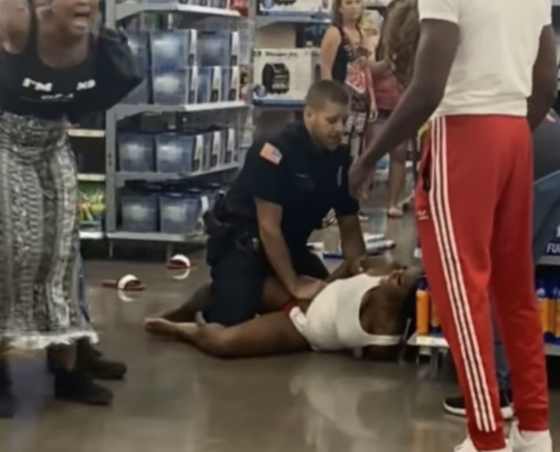 New York police officer placed on paid leave after hitting handcuffed woman who tried to bite him: report
