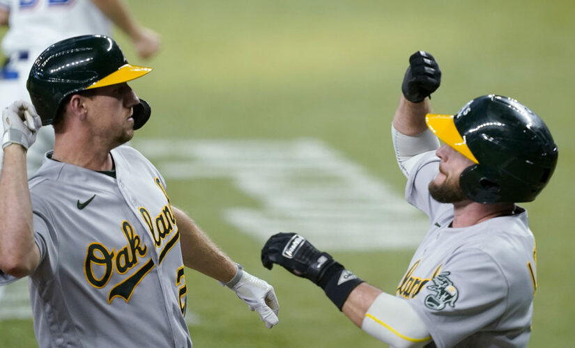 Oakland 4 runs in 11th to beat Rangers 8-4 in game of solos