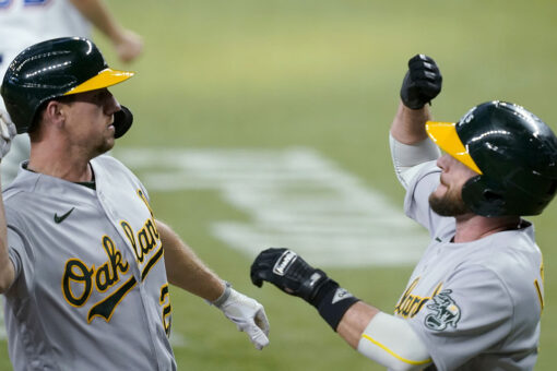 Oakland 4 runs in 11th to beat Rangers 8-4 in game of solos