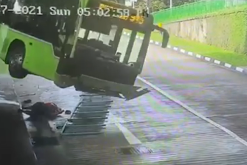 Driver narrowly escapes being crushed by falling bus
