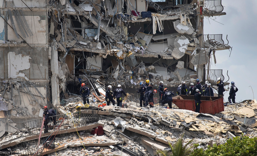 Woman trapped in condo rubble pleaded with rescuers to save her