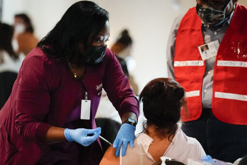 White House hits 70% vaccination goal nearly month later