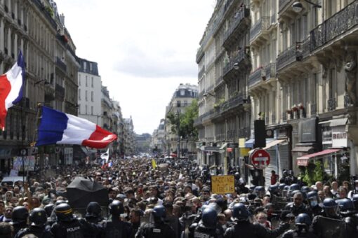 French police clash with anti-virus pass protesters in Paris